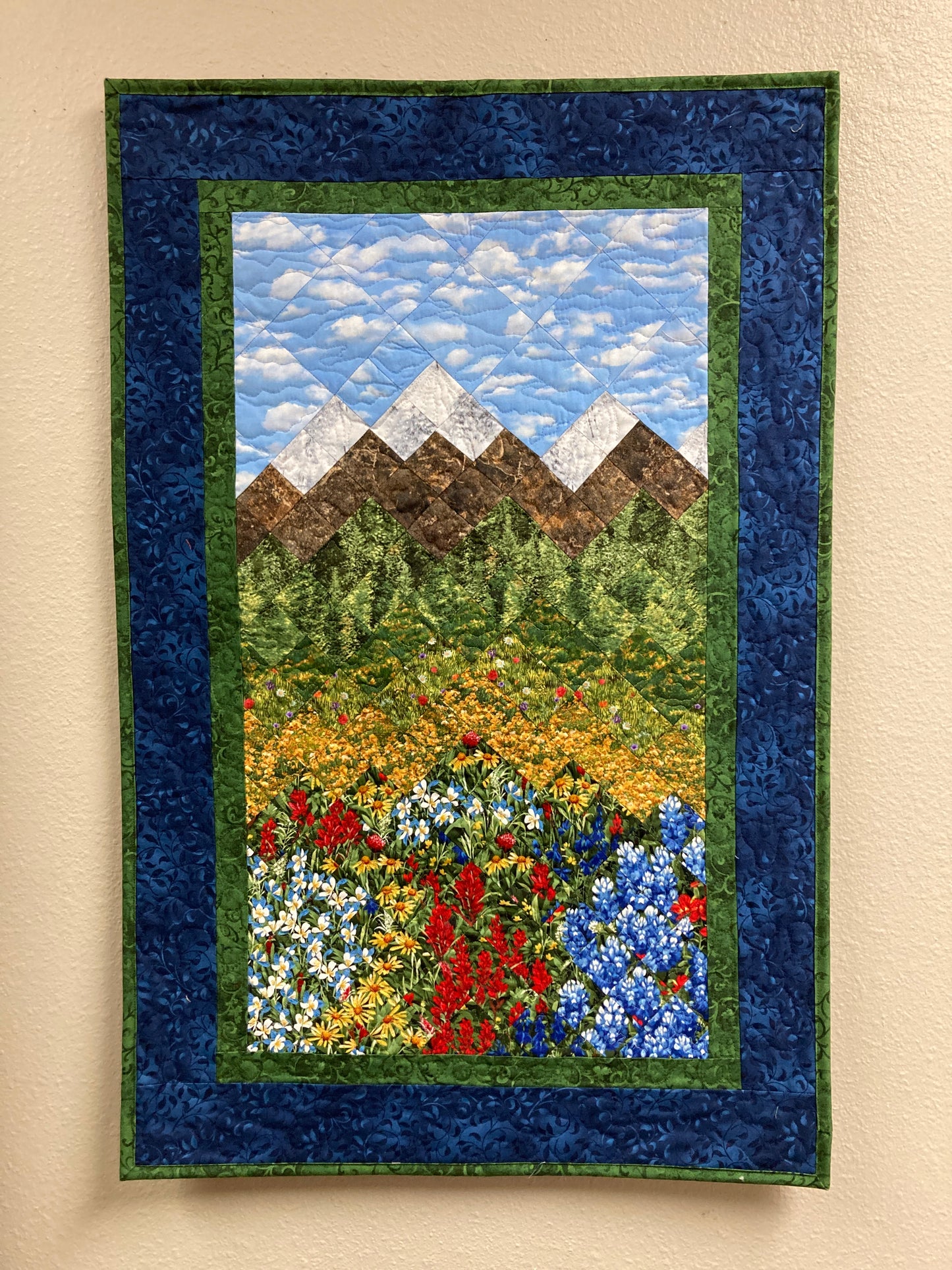 Wildflower Mountain Quilt Art Fabric Wall Hanging, Landscape Textile Art 22x34” Vertical Tapestry, Summer Blue Red Yellow Flowers Artwork